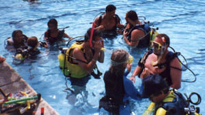 PADI Instructor with their students in the pool